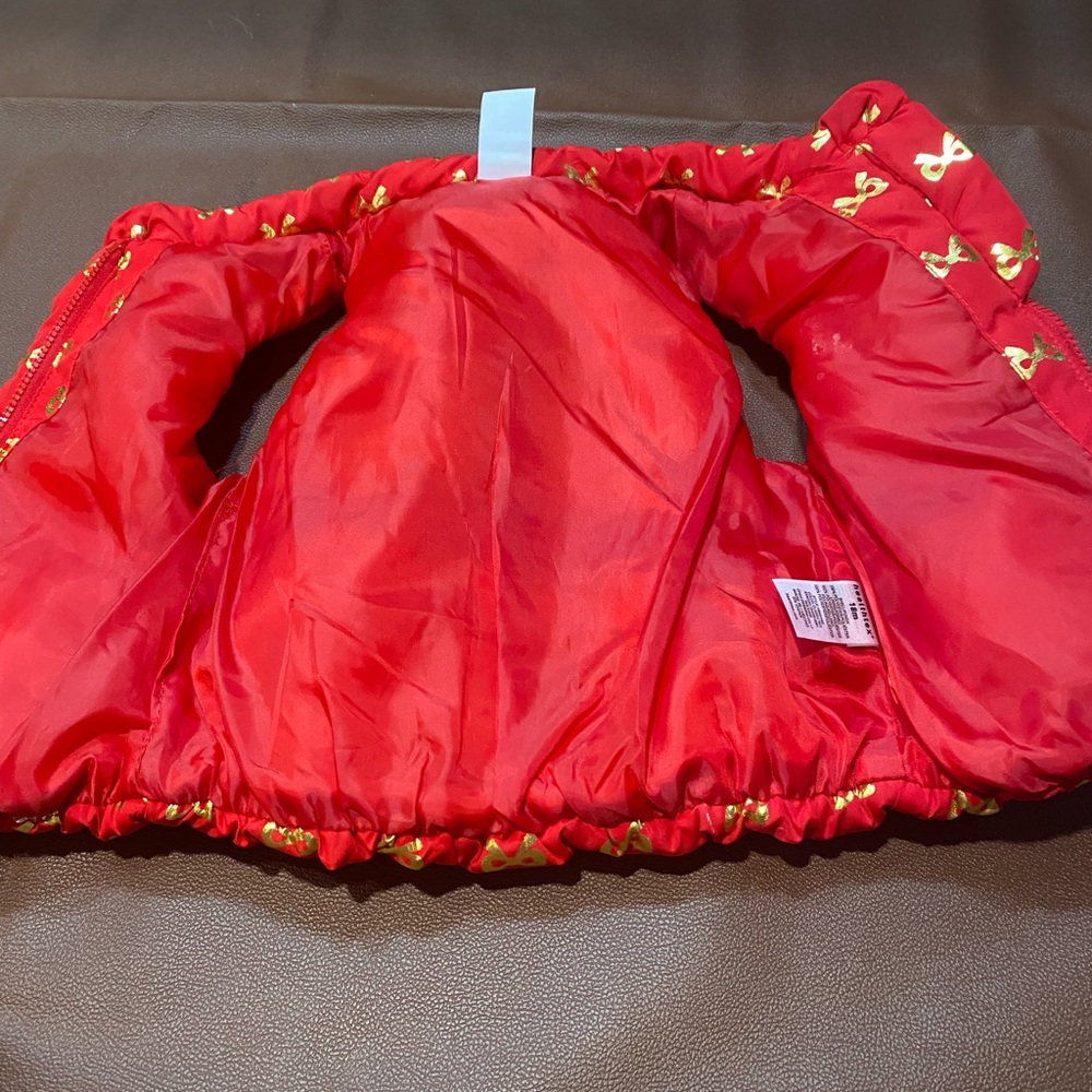 Red Puffer Vest with Gold Bow Pattern - Picture 3 of 6